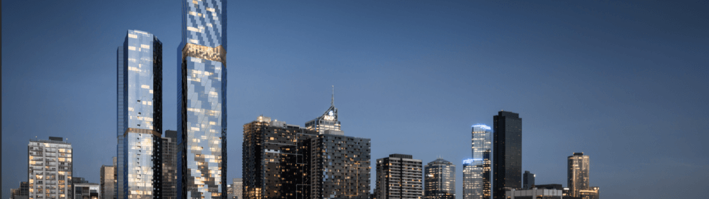 The skyline of a city at dusk showcases modern skyscrapers with reflective glass facades under a clear blue sky. Some buildings, perhaps designed using advanced CAD techniques or Graphisoft software, have their lights on, highlighting their structures against the evening backdrop.