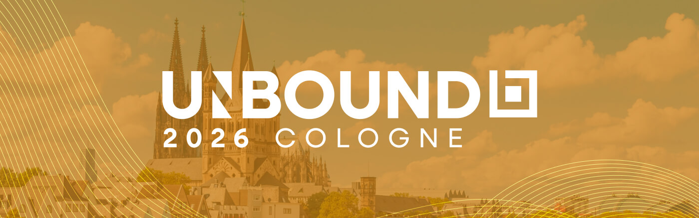 Weißer Text mit der Aufschrift UNBOUND 2026 COLOGNE überlagert ein Bild des Kölner Doms und einer Stadtlandschaft unter einem gelblichen Himmel, wobei geschwungene goldene Linien die unteren Ecken verzieren.